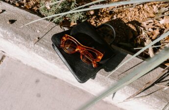 a pair of glasses sitting on top of a black case