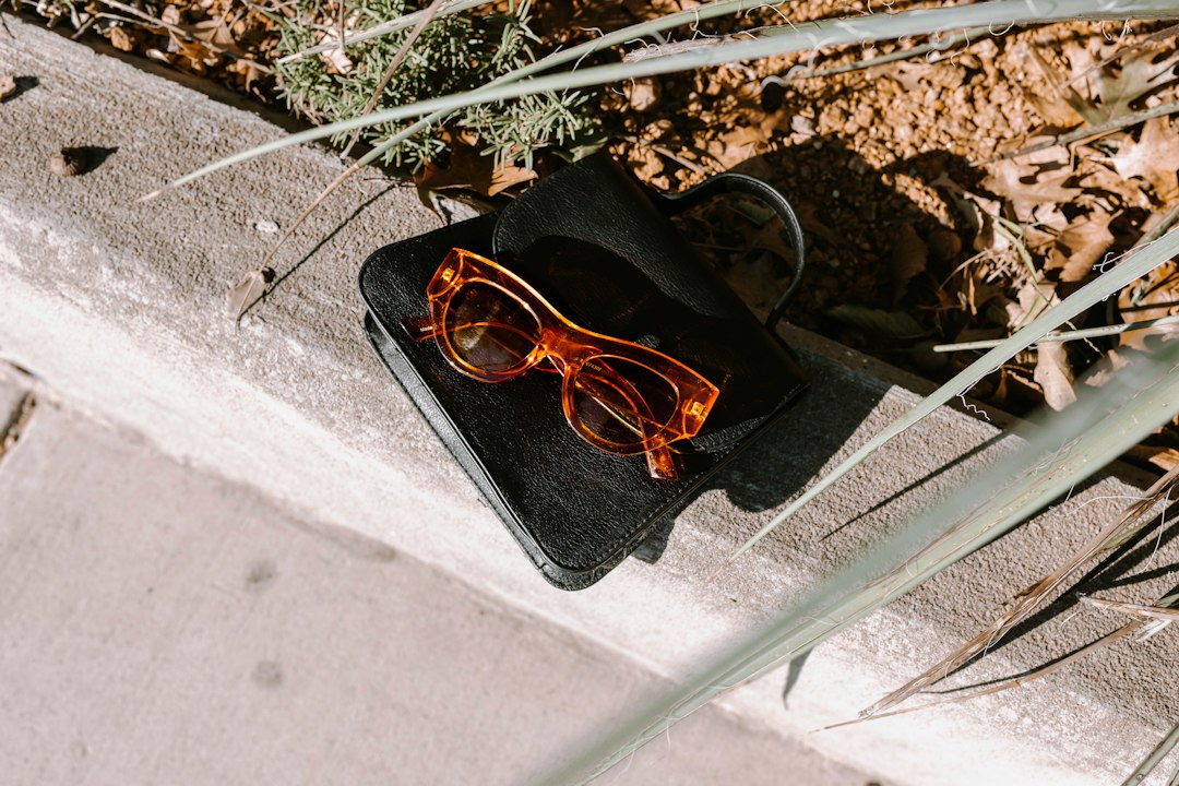 a pair of glasses sitting on top of a black case